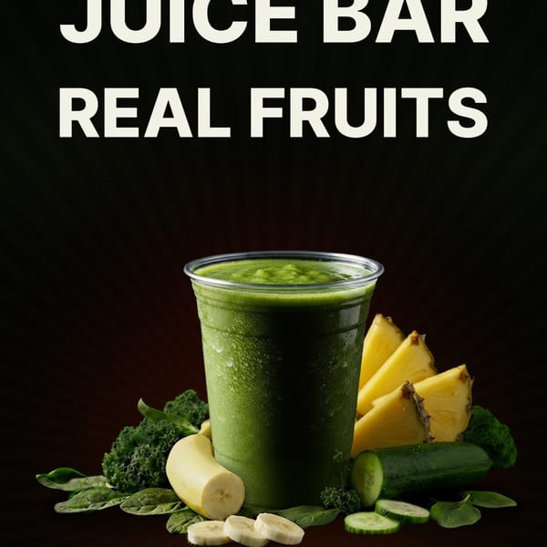 Green smoothie in a plastic cup surrounded by bananas, pineapple, cucumber, and leafy greens.